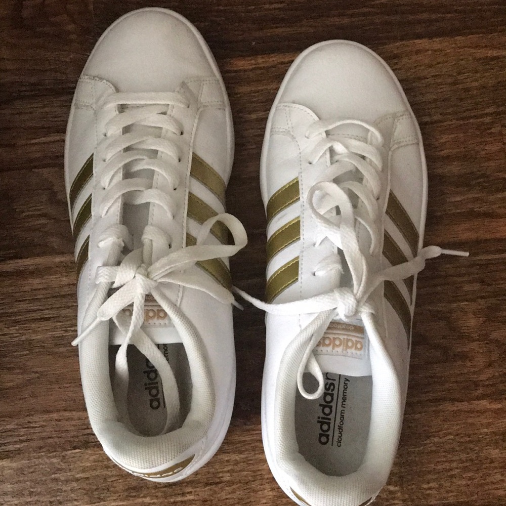 Adidas shoes with gold stripe